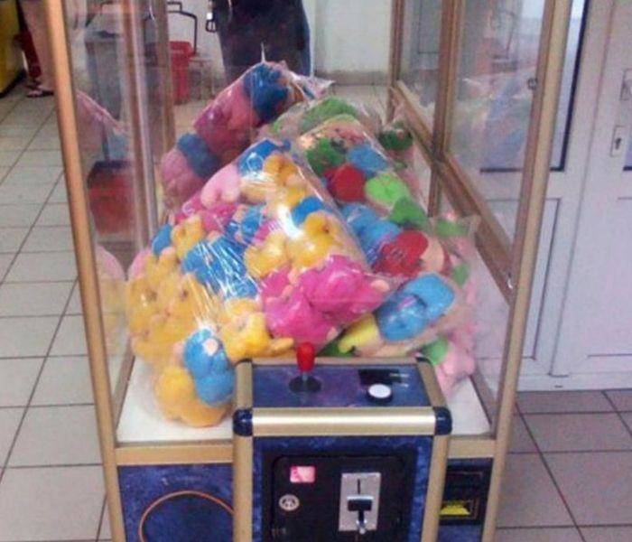 claw machine animals still sealed in large bag inside machine