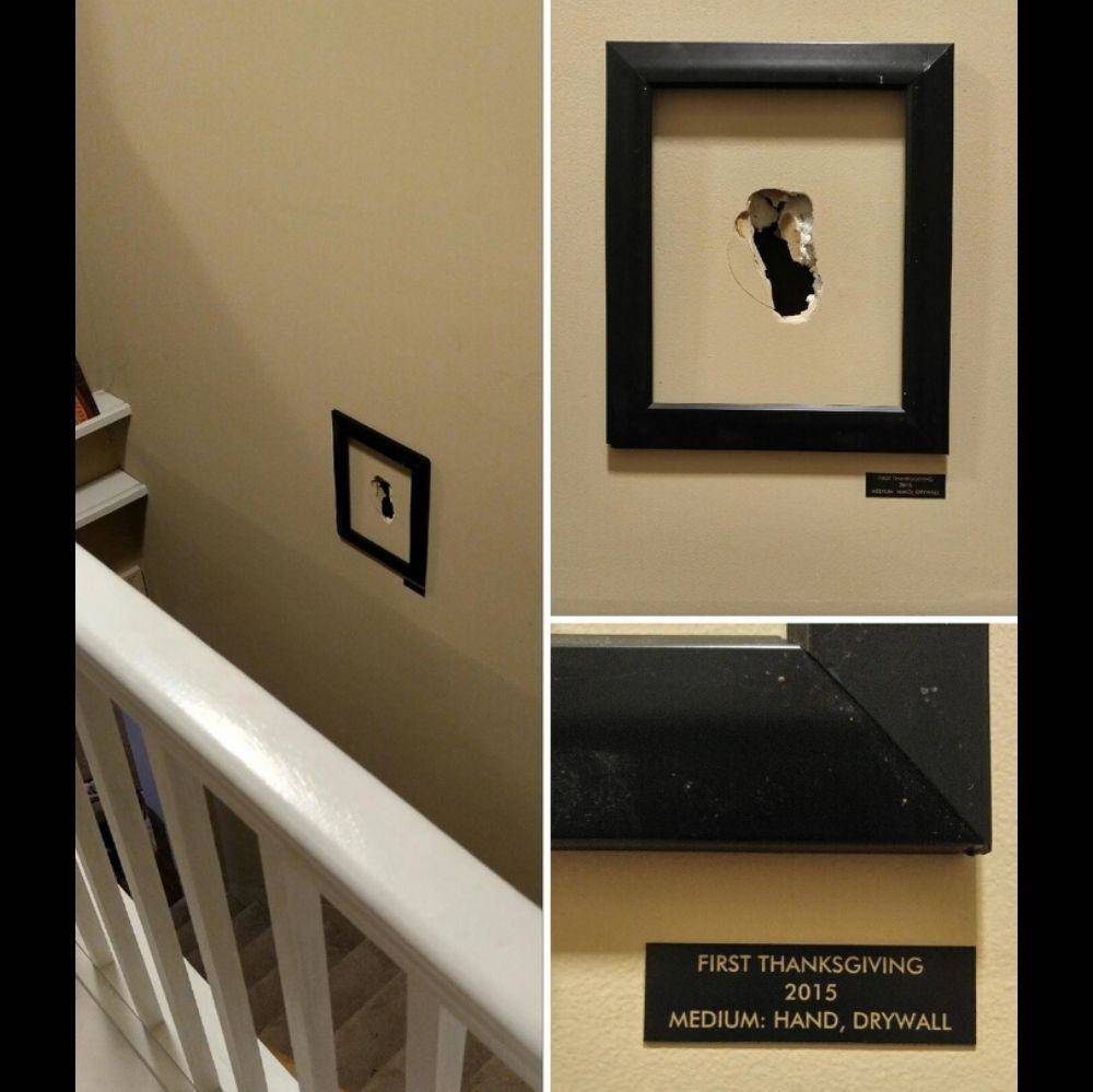 person frames hole in wall and titles it like an art piec