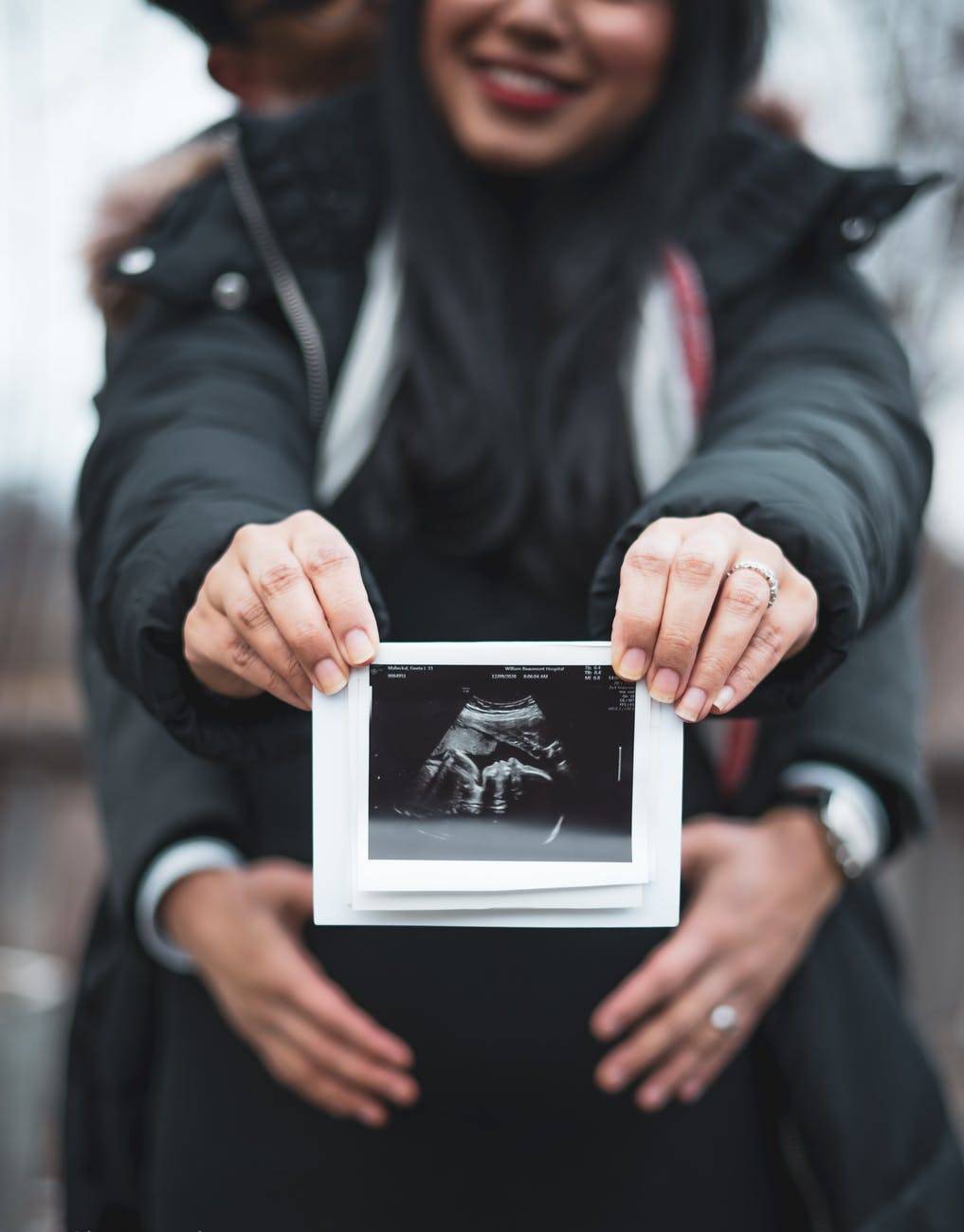 couple maternity shoot with ultrasound picture
