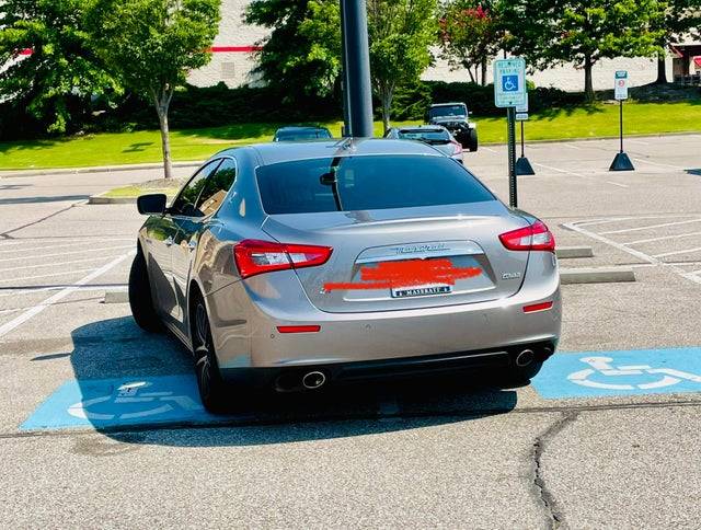 car on two handicap parking spots