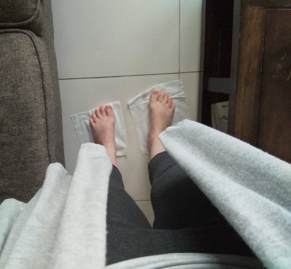 cleaning the floor with feet