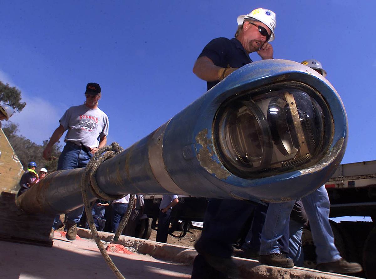 Navy and construction workers develop a periscope.