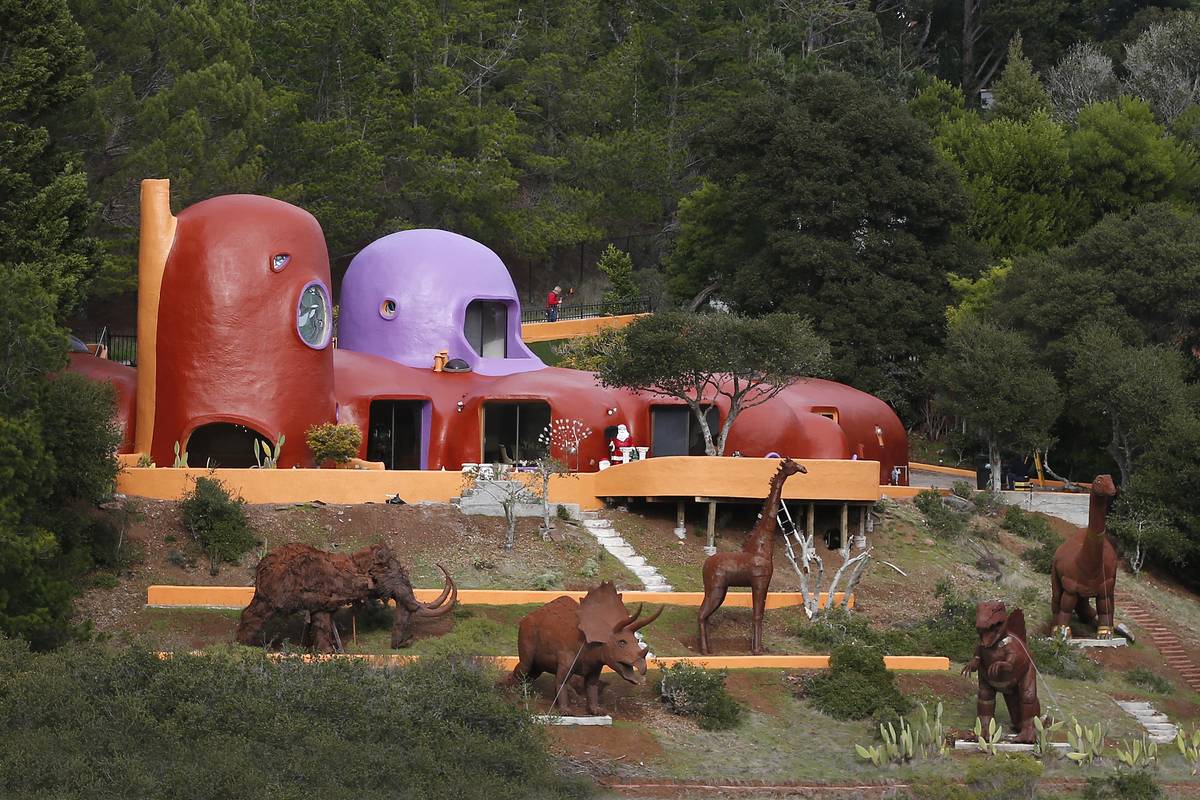 HILLSBOROUGH, CA - JANUARY 21: A menagerie of animals now stands guard at the famous Flintstone House, Sunday, Jan. 22, 2017, in Hillsborough, Calif. The three dinosaurs and their giraffe and mastodon partners appeared recently on the hillside home that sold last year for $2.8 million.