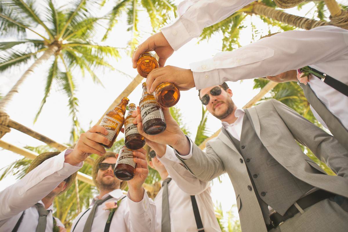 groomsmen cheers at wedding