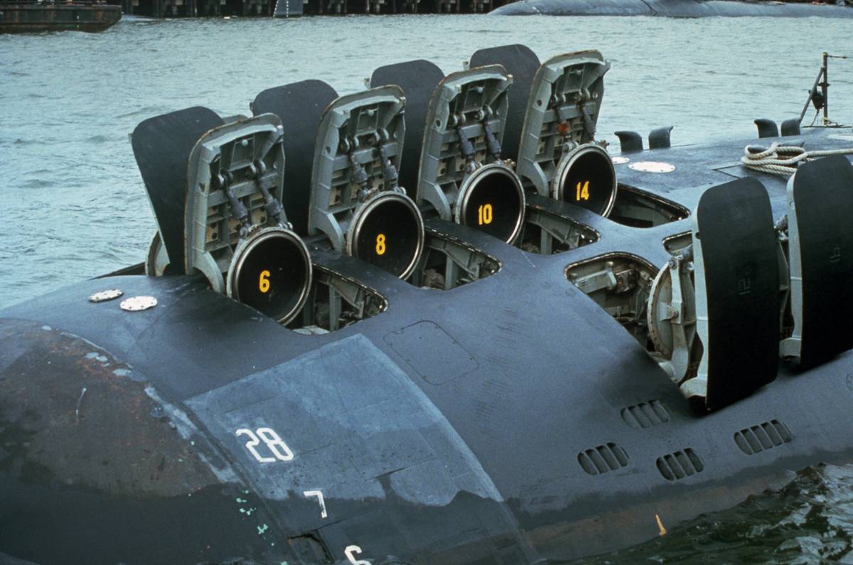 The hatches of 12 Tomahawk missile tubes on a submarine are open.