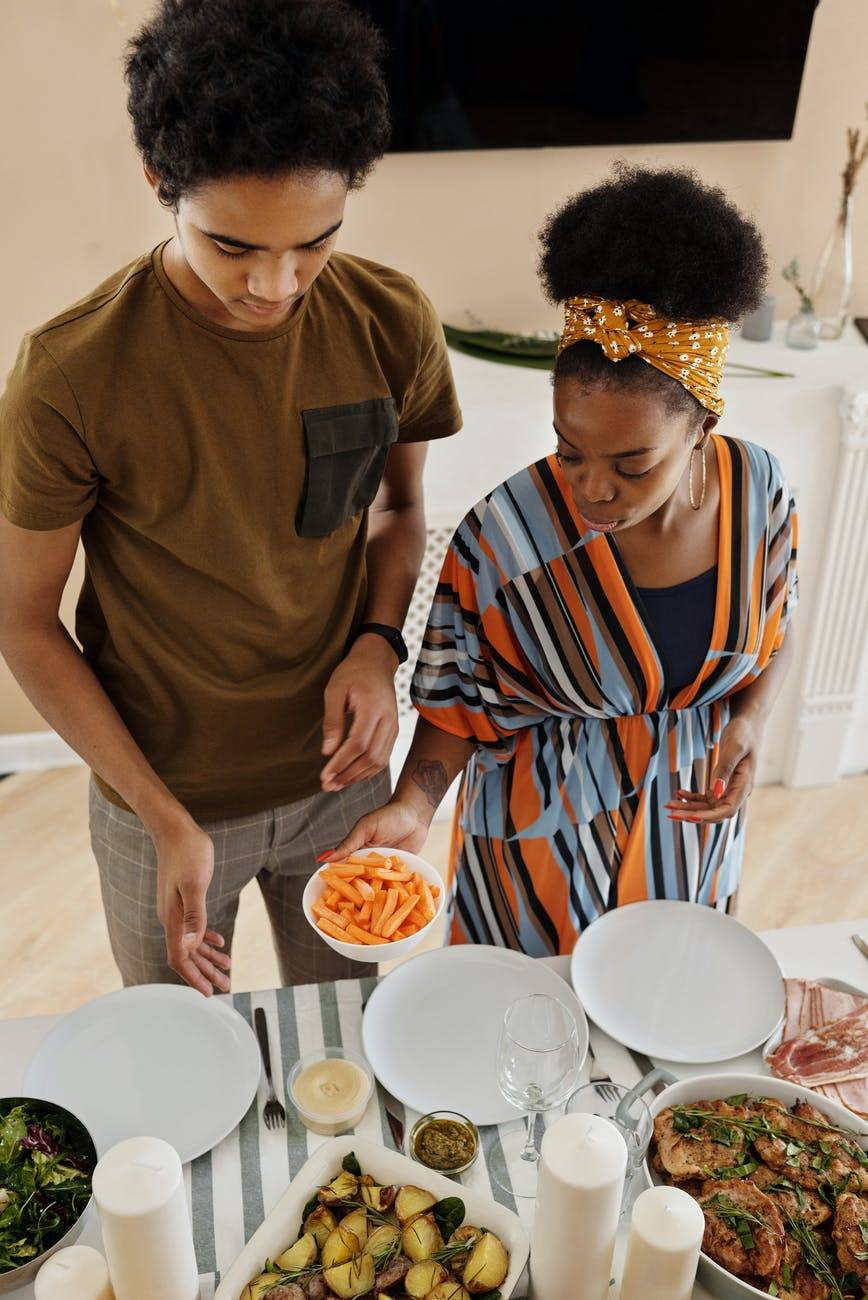 mother and son setting the table