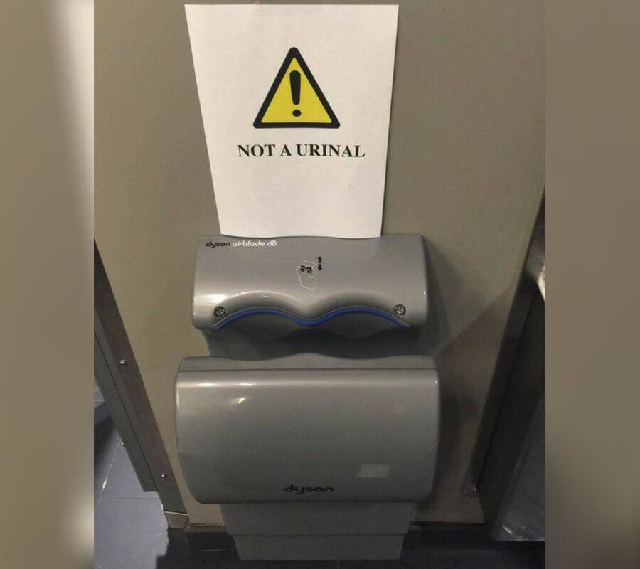 'not a urinal' warning over hand dryer