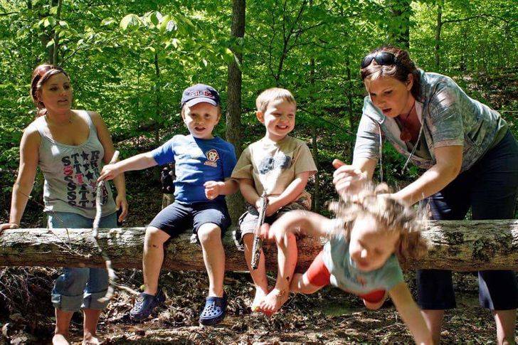 off the log she goes as the other kids laugh