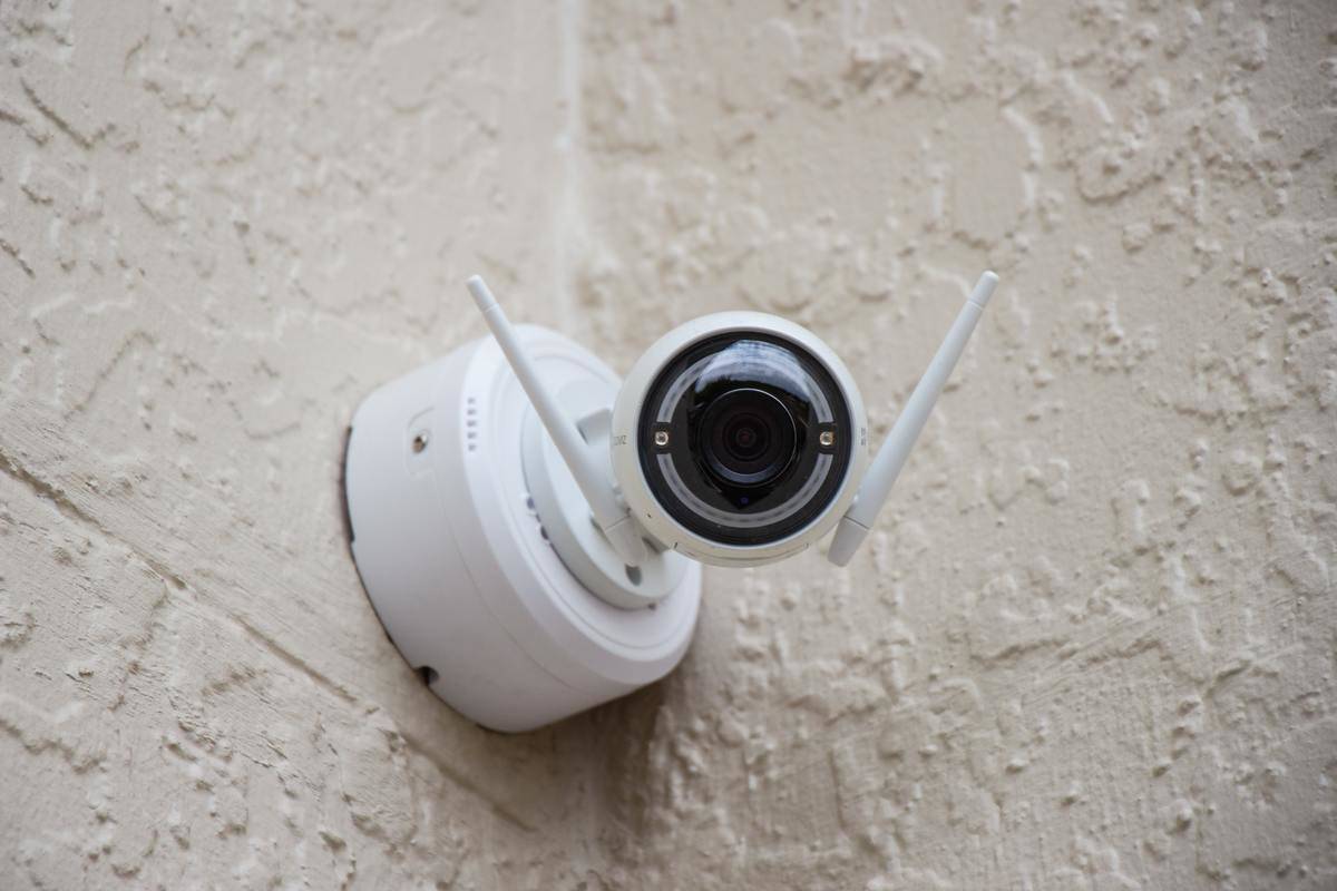 security camera mounted on a wall outside
