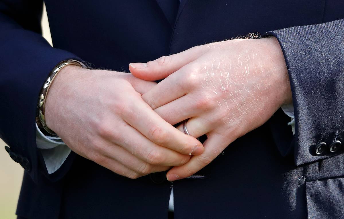 Prince Harry, Duke of Sussex (hand and wedding ring detail) hosts the Rugby League World Cup 2021 draws for the men's, women's and wheelchair tournaments at Buckingham Palace