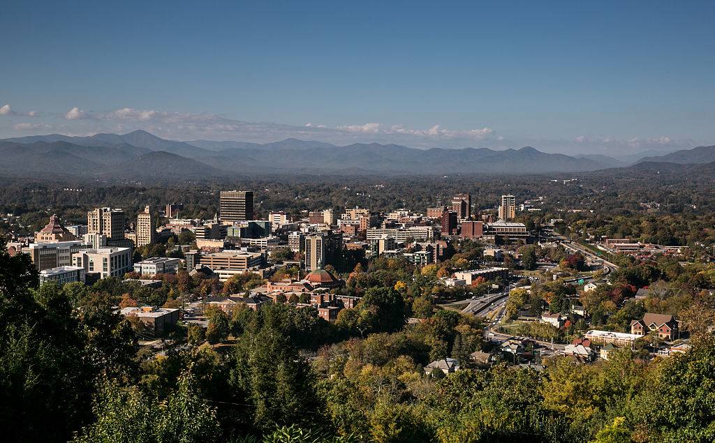 The downtown skyline is viewed on a sunny autumn day in Asheville, North Carolina