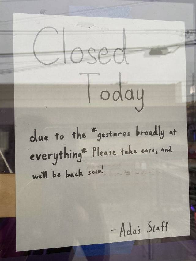 Closed today sign in bookstore window