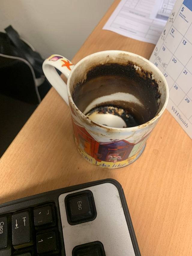 Photo of a coworkers disgusting coffee mug