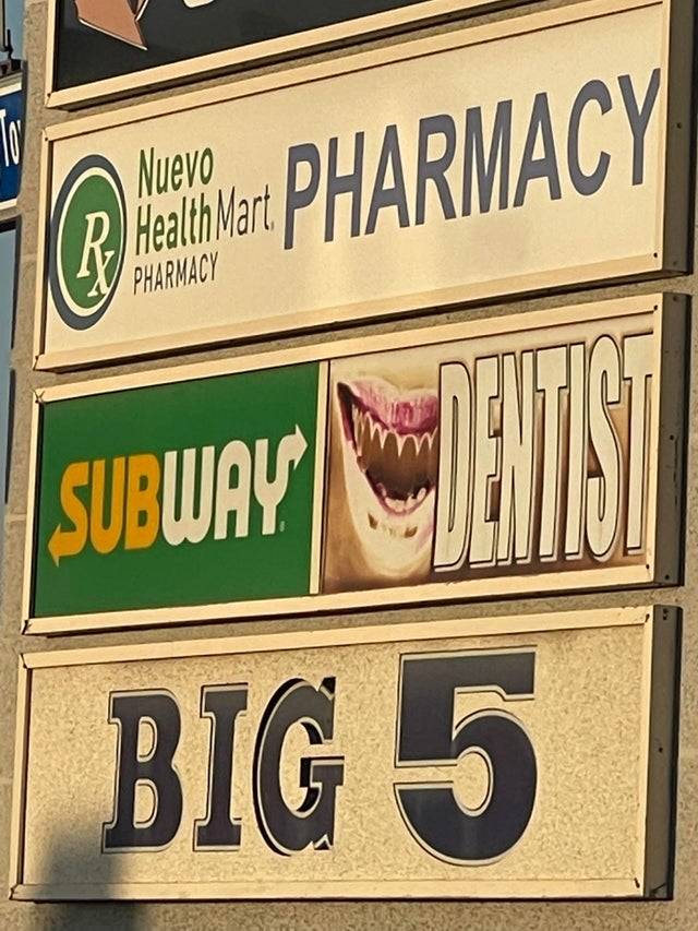 Dentist sign with missing teeth