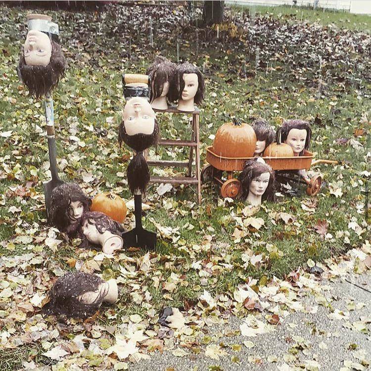 Hairdresser's Halloween decorations are mannequin heads on ground