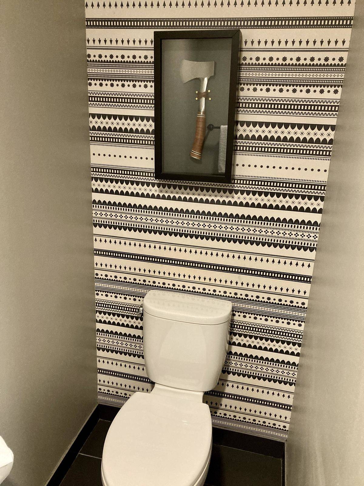 Hatchet over toilet in hotel