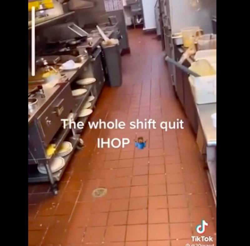 Video still of a customer wandering through the empty kitchen of an IHOP after all the employees quit