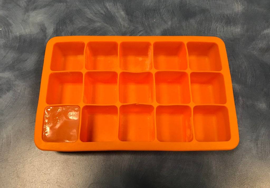 An ice cube tray with only one cube remaining because a coworker chose not to refill it