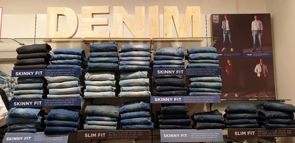 Clothing display at a store of multiple types of denim jeans