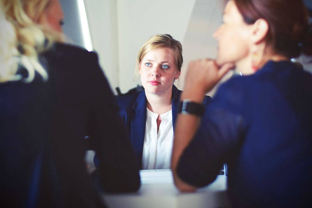 Woman attends job interview and is interviewed by two other women