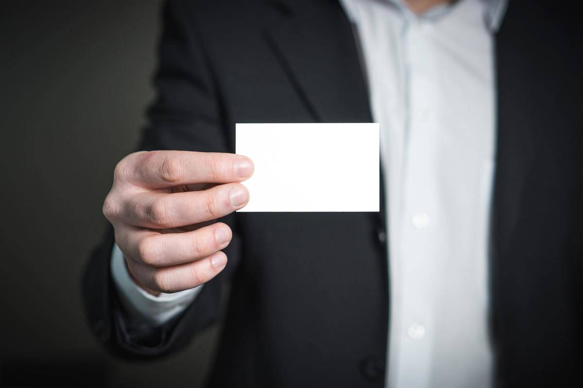 Man holding blank card