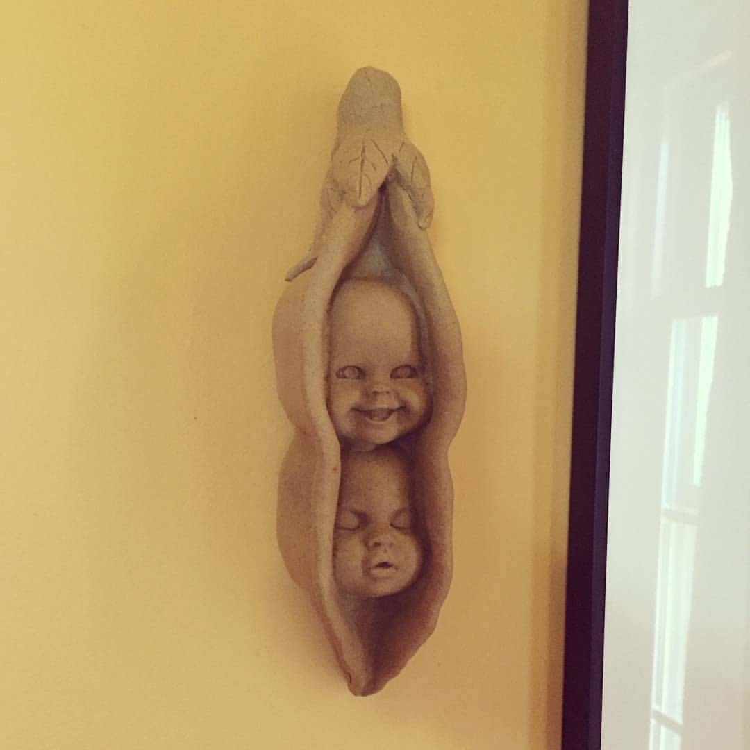 Peas in a pod clay model of babies hanging on wall