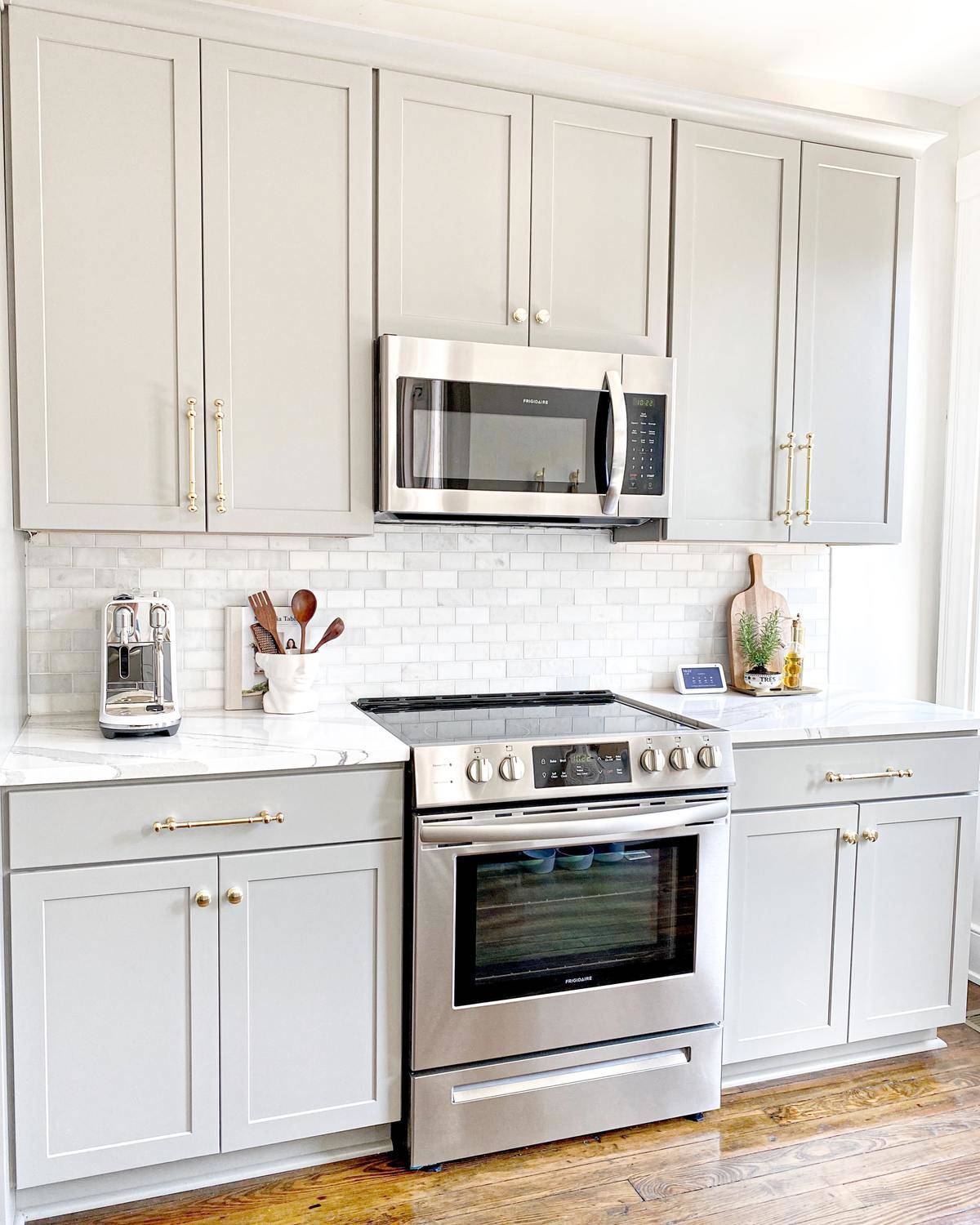 Bright kitchen and a stainless steel microwave and stove