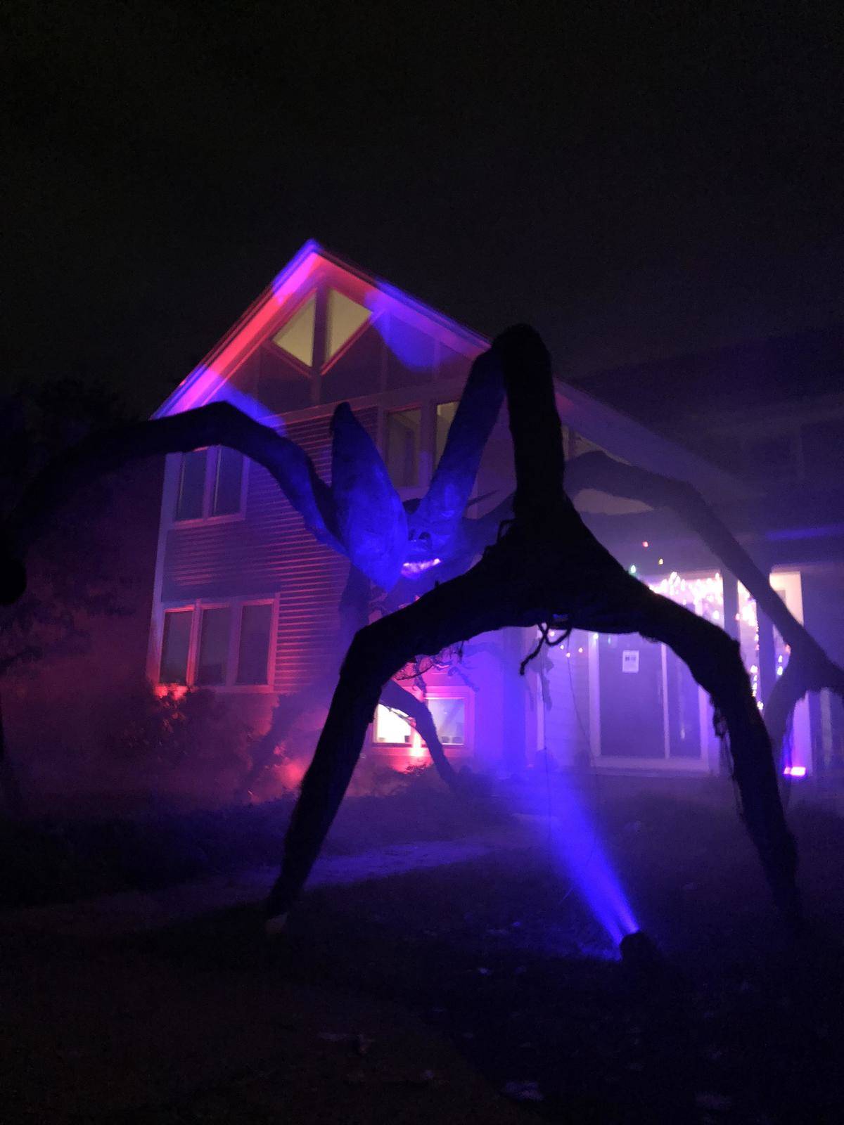 Stranger Things Mind Flayer startue on front lawn of house