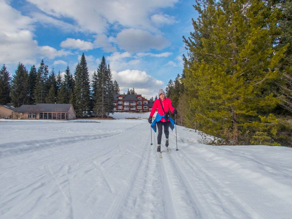 woman cross-country skiing in the spring