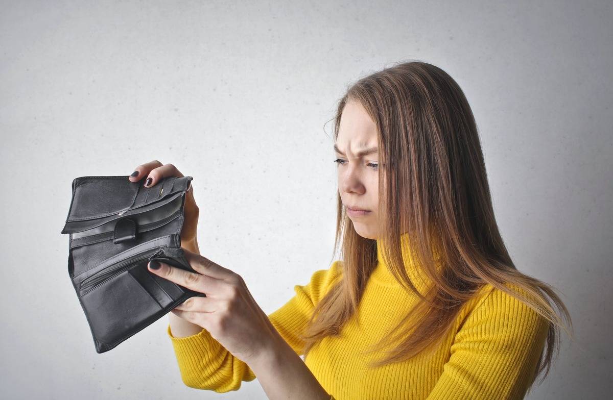 person opening empty wallet