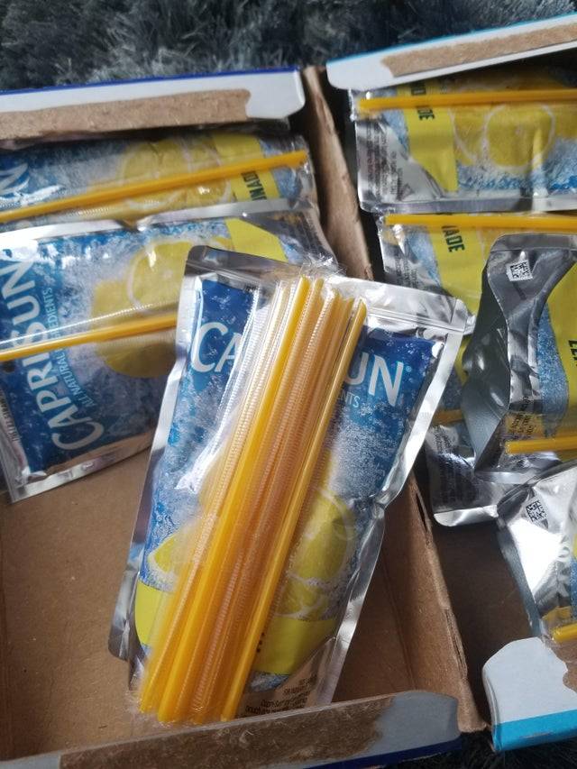 many straws attached to capri sun drink