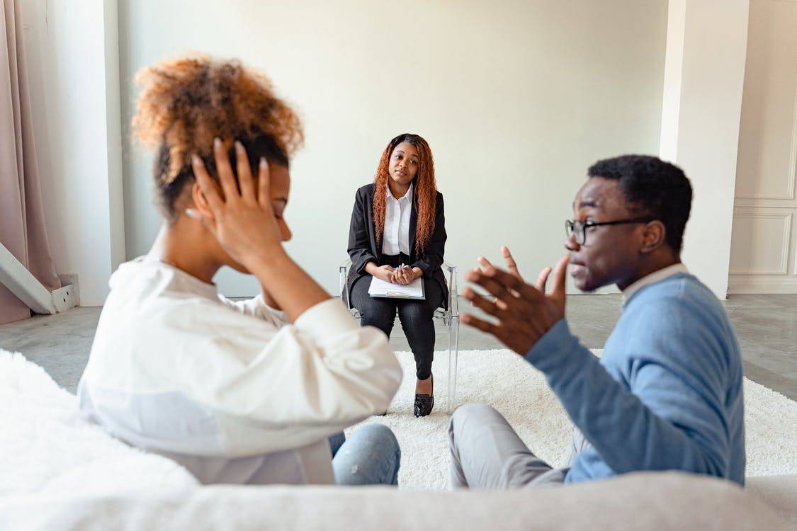 couple arguing in front of therapist