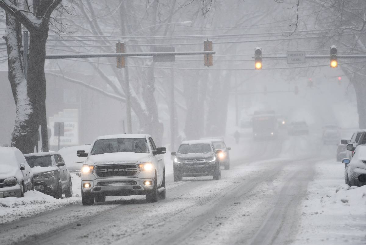 Cars drive through a snowstorm in Pennsylvania.