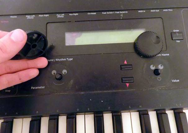 faces under knobs of a keyboard