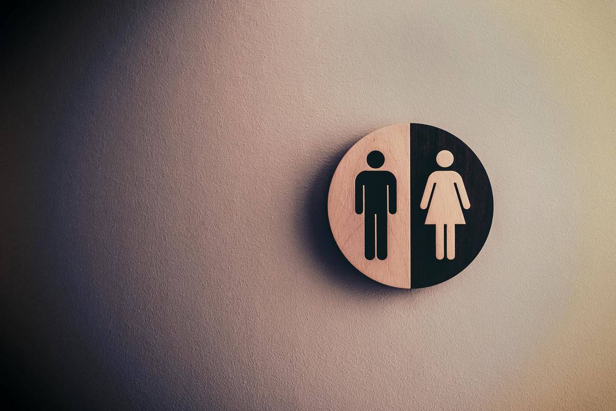 a sign with figures of a male and female
