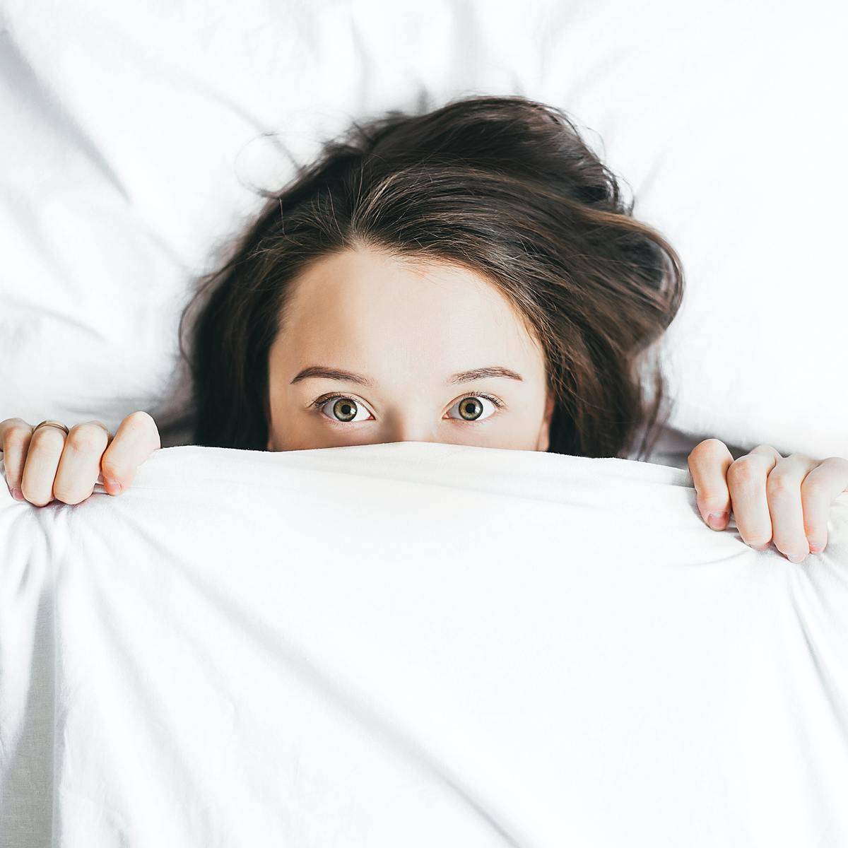 a woman awake in bed