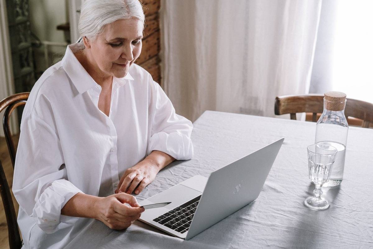 older woman using laptop 