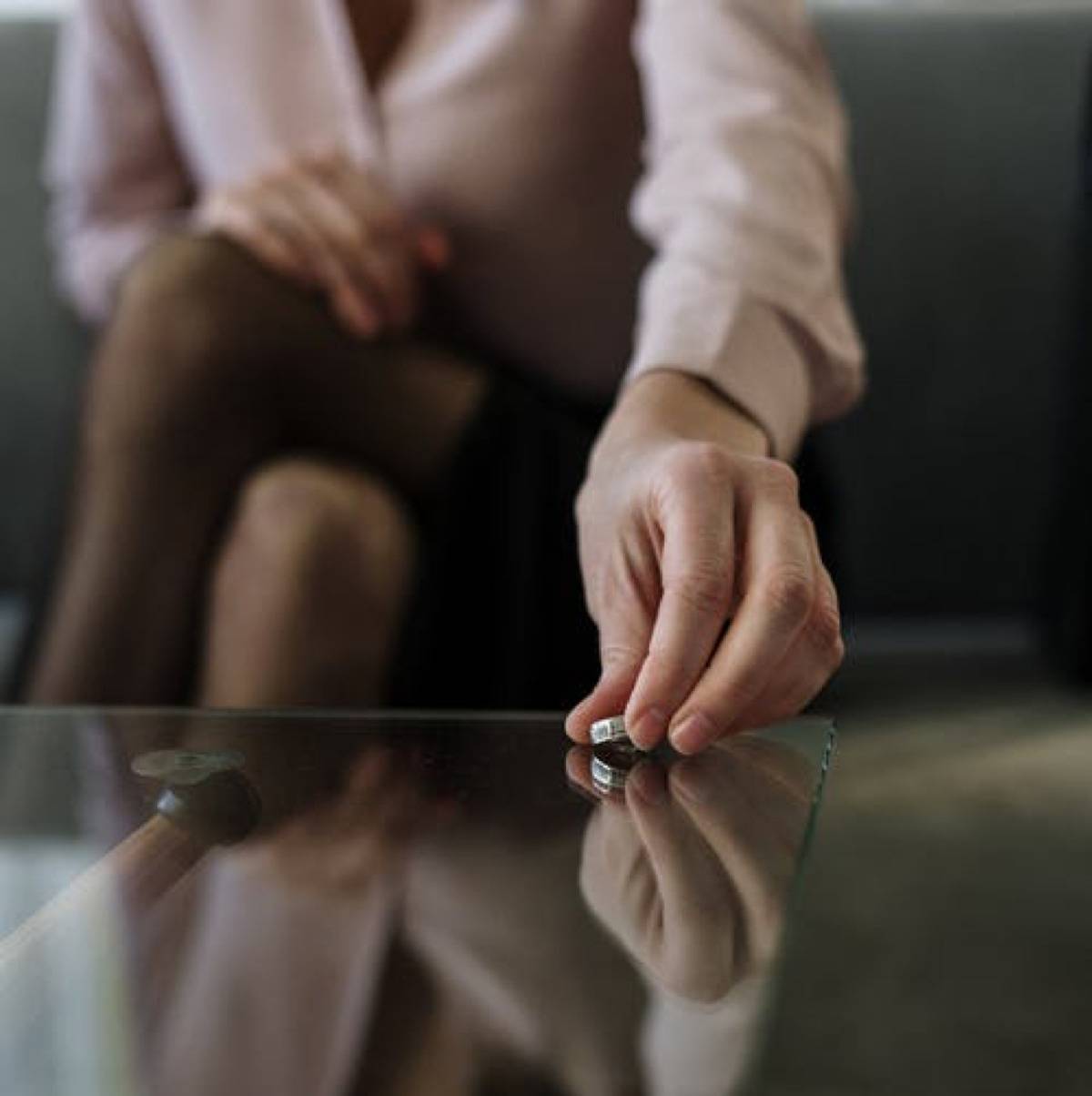 woman putting ring down on table