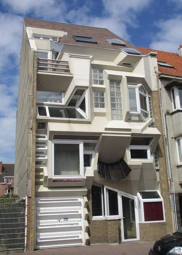 oddly designed house with windows in random places