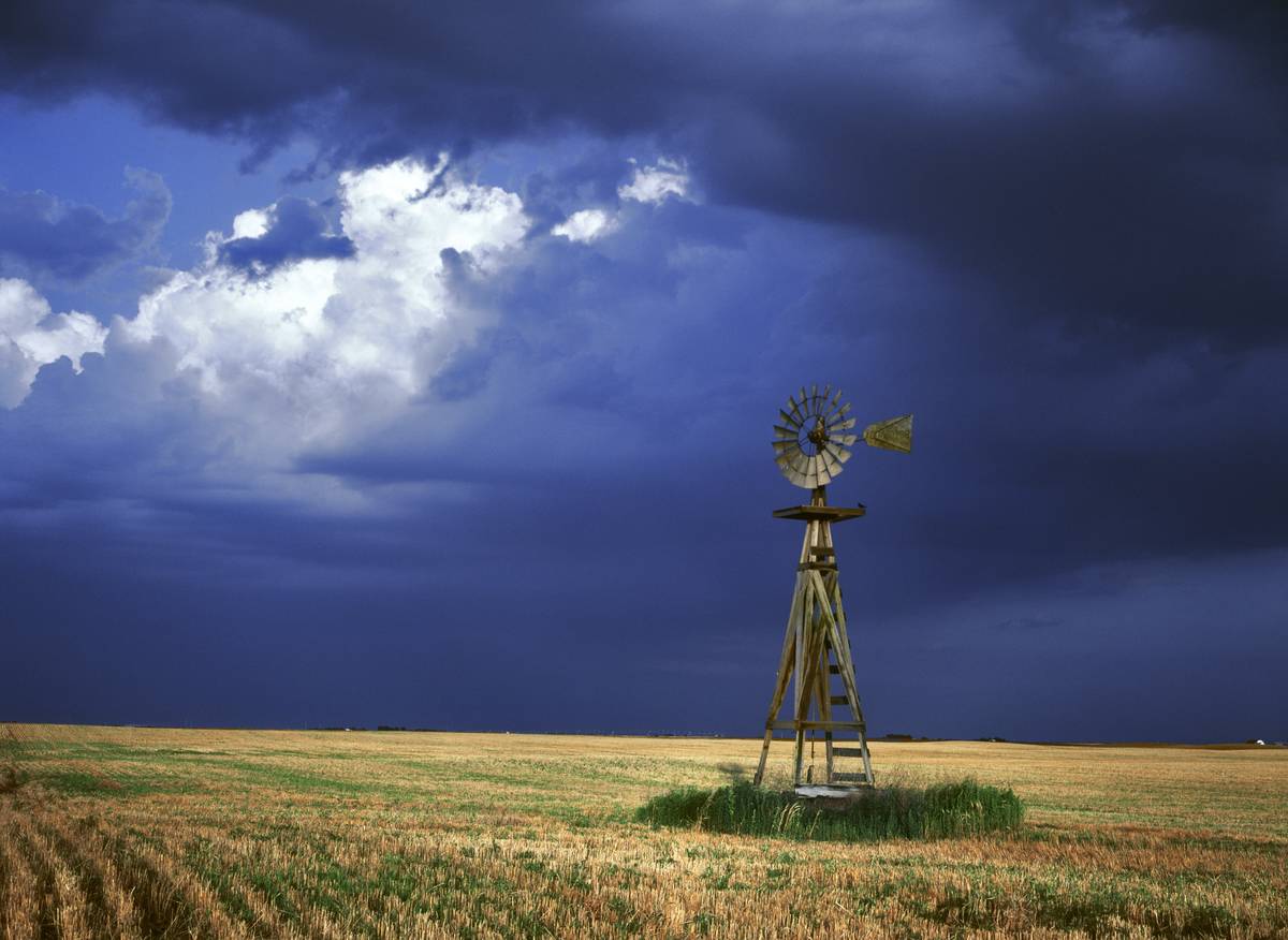 A lone windmill stands on a farm in Kansas.