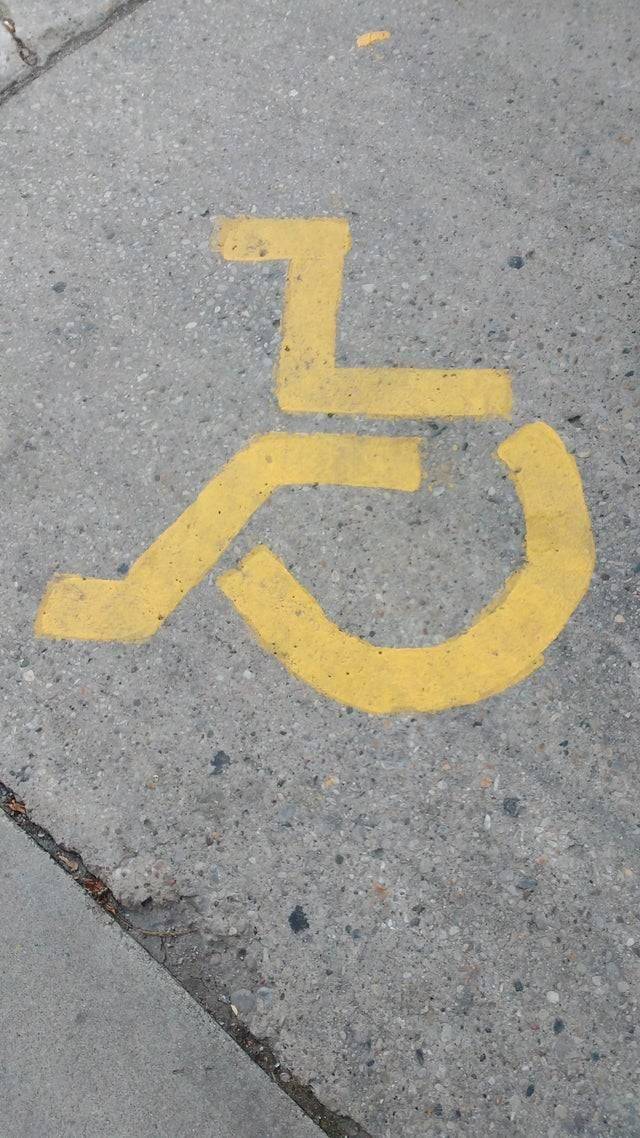 handicap sign in parking lot painted wrong