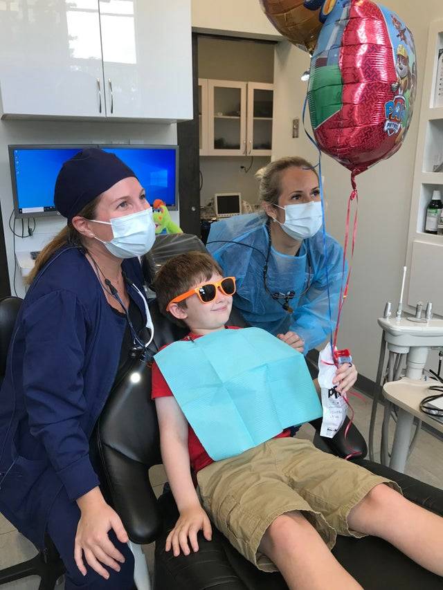 Child celebrating birthday in the dentist office.