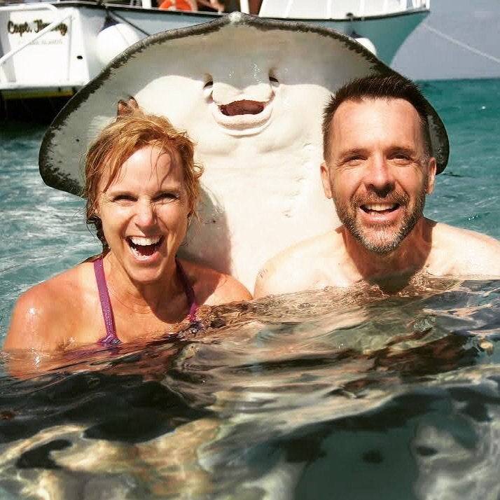 Husband and wife take photo of themselves while on vacation and get photobombed by a stingray
