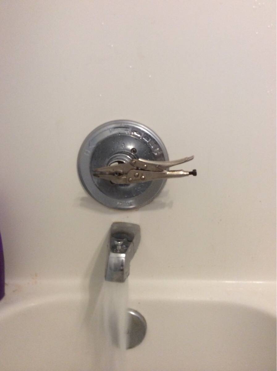 Pliers are the replacement handle for a broken shower handle
