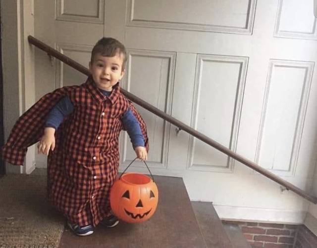 Child dressed up as a shirt for Halloween. 
