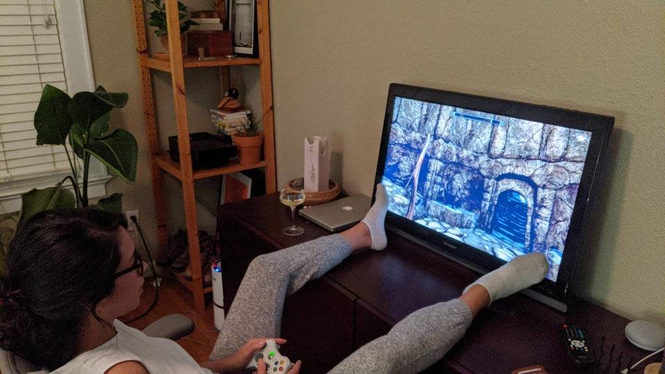 Wife plays video games after her husband gets her into them.  