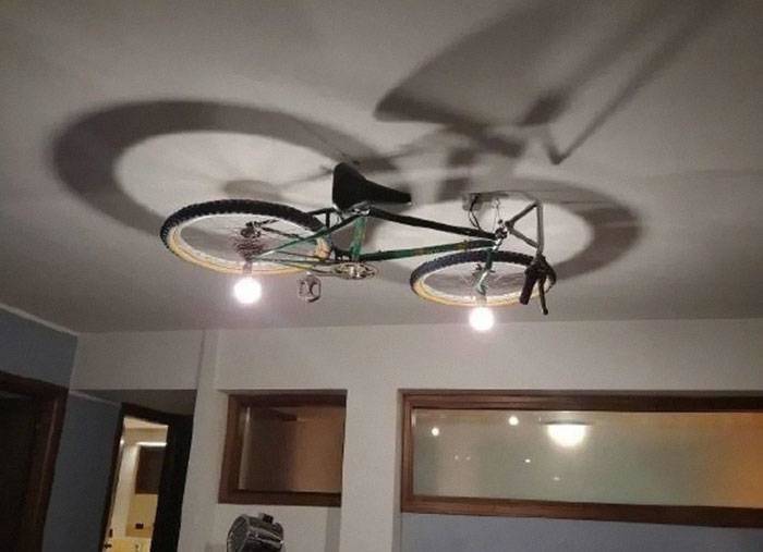 bike mounted on ceiling as light fixture