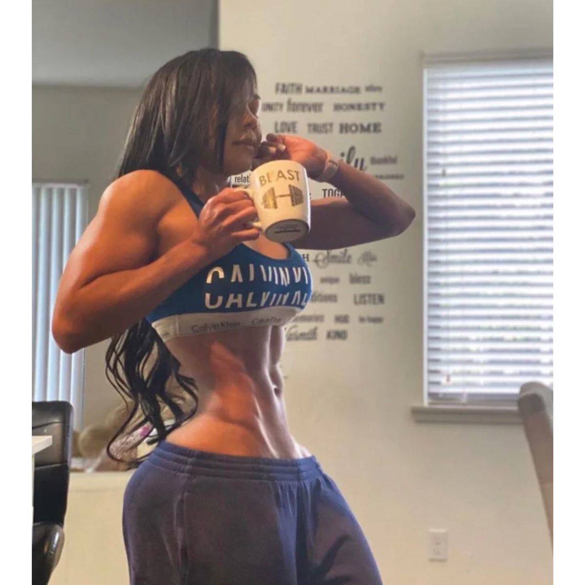 heavily edited photo of fitness influencer with tiny waste and huge bottom
