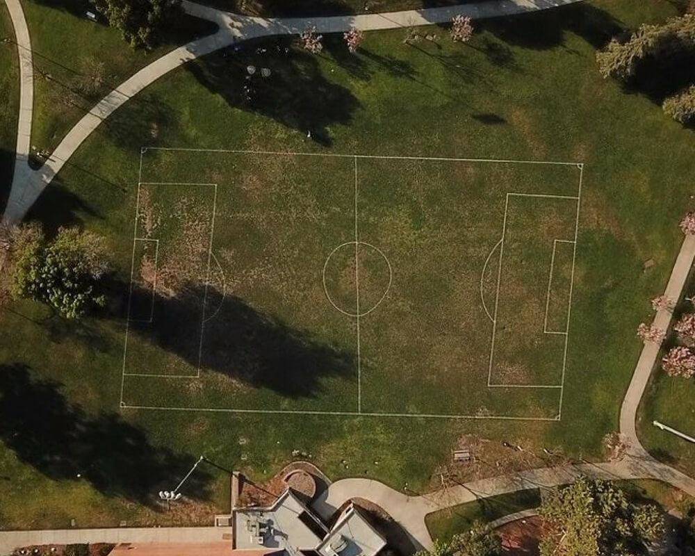 really crooked soccer field drawn on ground