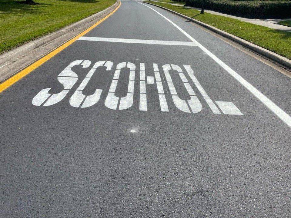 misspelled school sign on road
